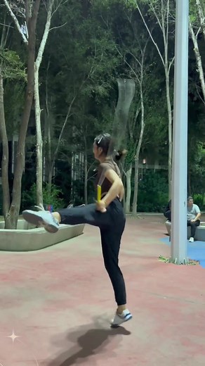 Female Martial Artist Demonstrates Wushu Kung Fu Techniques