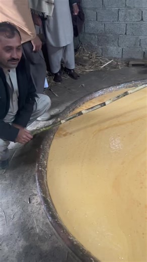 Traditional Liquid Extraction Process in Rustic Setting