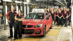 Holden supporters create a human 'Holden' formation outside closing factory
