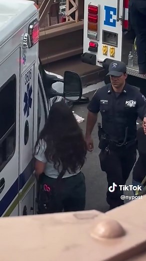 NYPD officers rescued a woman who climbed onto the steel beams of the Brooklyn Bridge Friday, appearing to be at risk of jumping. Video showed her perched high above the water as pedestrians watched the rescue unfold.