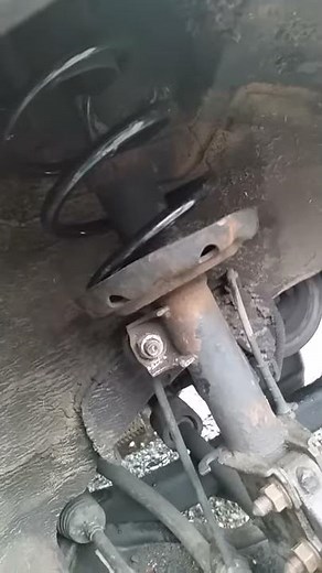 Changing the front suspension spring vauxhall combo