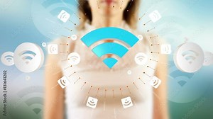 Young female pressing the screen then wireless symbol appearing. Futuristic touch screen concept.