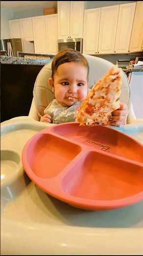 Baby eating pizza for the first time | Baby’s reaction