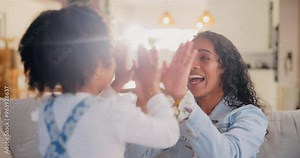 Mother, child and playing clapping game on sofa in home for fun activity, bonding and learning motor skills. Happy family, woman and daughter in living room with teaching, development or coordination