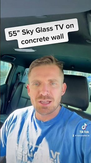 55” sky glass TV mounted onto a concrete wall