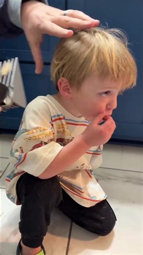 Clipper guards in use with a toddler