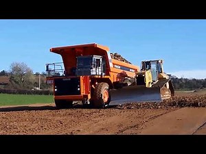 CAT D6 dozer at work pushing gravel for road construction (part 2)