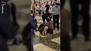 Two women brawl over the bouquet at wedding reception