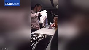 Ouch: Moment flaming Sambuca shot goes horrendously wrong