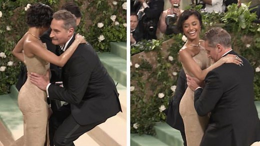 Tyla lifted up stairs at 2024 Met Gala in form fitting dress