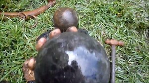 Two cannonballs found close together - one was hidden under a shell of stone
