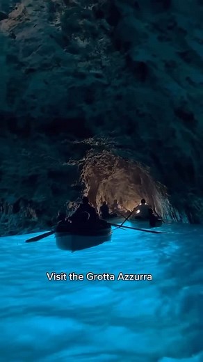 Vacations on Instagram: "The Blue Grotto in Capri is pure magic — a sea cave where sunlight reflects off the limestone seabed to light up the water in an electric blue glow. Accessible only by small rowboats, the entrance is just a meter high, so visitors must duck to slip into this surreal, glowing world. 💙 Would you be brave enough to explore this cave!? 🇮🇹 Video by: @welcomearound #capri #italia #bluegrotto #italy #vacations #capriisland #island #cave #travel #instatravel #igtravel"