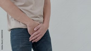 Man hold hand in front of private parts feeling discomfort from disease and inflammation. Venereal, testicular cancer. bladder problems, erectile dysfunction, premature ejaculation, prostate cancer Stock Video