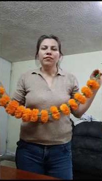 I made this Marigold flower garland using straws to decorate the Day of the Dead altar