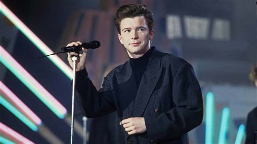 Rickrolling ‘80s singer Rick Astley, 60, is more handsome than ever as a silver fox in new concert pics