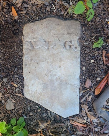 US homeowner finds stone with mysterious initials in backyard