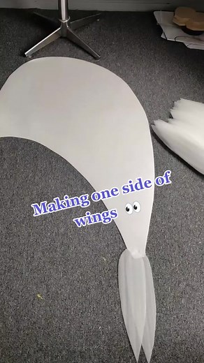 Adding feathers to one side of wings 👀 Still need to cut a lot of feathers 🤯#cosplay #whitewings #wingdecor #angeldecor #angel #diy #workingprocess #tiktok #angelwings