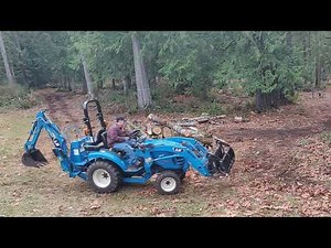 moving logs with a sub-compact tractor and grapple (Time-Lapse)LS xj2025h and Land Pride 54' grapple