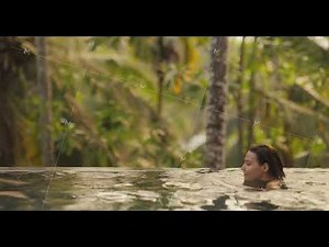 Spa Couple Relaxation in a Tropical Infinity Swimming Pool Outdoors