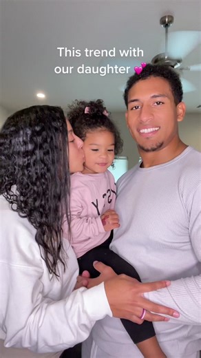 Sweet Moments: Baby Girl Kisses with Parents