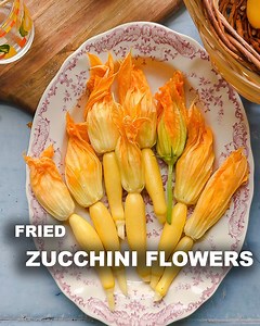 Fried Zucchini Flowers are one of my Summer favs! Ingredients: 1 cup of flour 1 tsp of sugar 1 tsp instant yeast 1 cup warm water 1 egg 1 tsp of salt About 1 dozen zucchini flowers 1 cup or so of fresh ricotta Plenty of parm Salt and pepper to taste #summerrecipes #zucchini #italy | Laura in the Kitchen