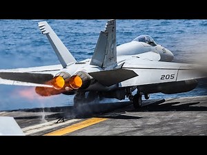 F/A-18 Super Hornets manoeuvring, taking off and landing on the flight deck of aircraft carrier