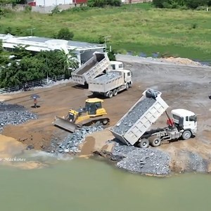 1.2M views · 10K reactions | Heavy equipment Showing Skills on Road Building That Filling with Stone into Water Source : Mr Machines at YouTube channel | Alat Berat Mania | Facebook