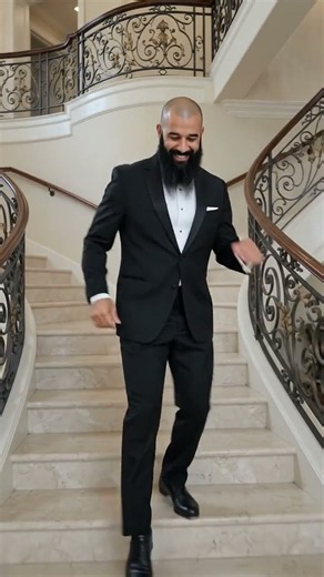 Samson Biggz In A Tuxedo Tap Dancing On A Staircase