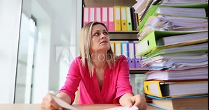 Woman Manager with bunch of papers and folders holding sign of help