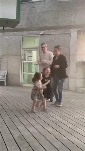 Omri Miran dances with his wife Lishay and his two daughters Alma and Roni