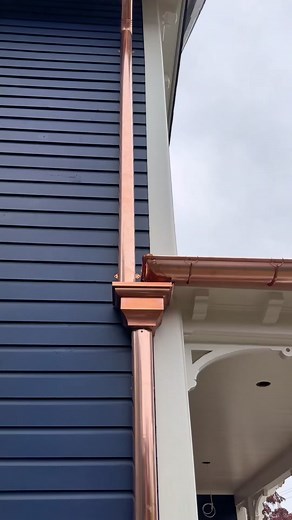 Enhance Your Blue House with Stylish Copper Gutters