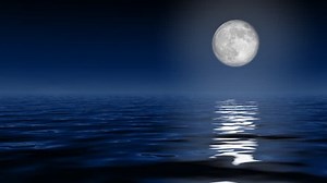 Big full moon over ocean