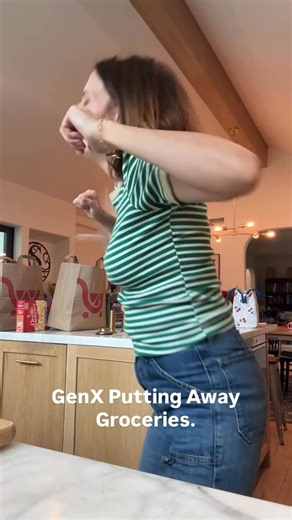 Kristin & Jen on Instagram: "Jammin to a JAM. #puttingawaygroceries #snoopdog #washinggrapes #dailydance #manifestation #herewego #genx #love #funny #momlife #comedy #morecomedy"