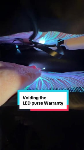 Want to see the inside of one of those LED purses? Cuz I cut mine open to rearrange it’s guts. Looks like the fiber optic strings from one side was accidentally glued to the other side, making the free space more intruded upon than it needed to be. Warning: if you bought one of these and want to do the same thing, know that you can’t without voiding the warranty. #ledpurse #ledlights #rgb #leds #fiberoptics