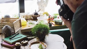 Pro photographer shooting food in restaurant