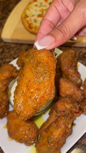 Destiny symone on Instagram: "My famous Crispy Lemon Pepper Chicken wing recipe 🥰 (This recipe has over 12 million views on TT 😮‍💨) Ingredients: Chicken wings 1 tbsp Creole seasoning 1 tsp Onion powder 1 tsp Garlic powder 1 tsp Paprika 3 tbsp Hot sauce 1/4 cup yellow Mustard 1 cup Flour 1/4 cup Cornstarch Vegetable oil (for frying) 1 stick Butter 1/4 cup Lemon pepper Squeeze of Lemon juice Ranch or blue cheese for dipping Season the chicken wings with Creole seasoning, onion powder, garlic po