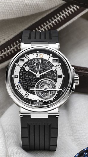 Breguet presents a new take on the Marine Tourbillon Equation Marchante 5887. This exceptional timepiece pairs a platinum case with a striking black dial in gold, featuring three mechanical high complications: a running equation of time, a perpetual calendar, and the iconic tourbillon. This marvel of precision and elegance is also a masterpiece in term of craftmanship with notably the engraving of the vessel "Royal Louis" on the bridges. To discover more about these novelty, visit: https://www.b