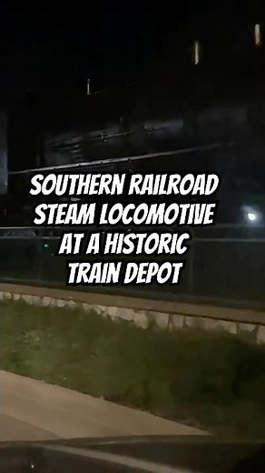Historic Southern Railroad Steam Locomotive with the Coal Tender and the Caboose at a train depot
