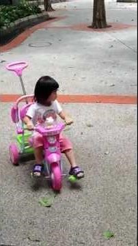 Elmo: "Riding a tricycle easy to do~"