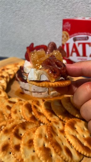 Bring in the new year with this literal “cheese cake” 🧀✨ This is an easy way to transform your cheese board into a showstopper for your New Years Eve celebration 🎊🪩 Served with Arnott’s Jatz, this brie cheese cake is made with quince paste, honey comb, sliced meat, and fruit. #charcuterie #arnotts #entertaining #NYE | Arnott's Biscuits