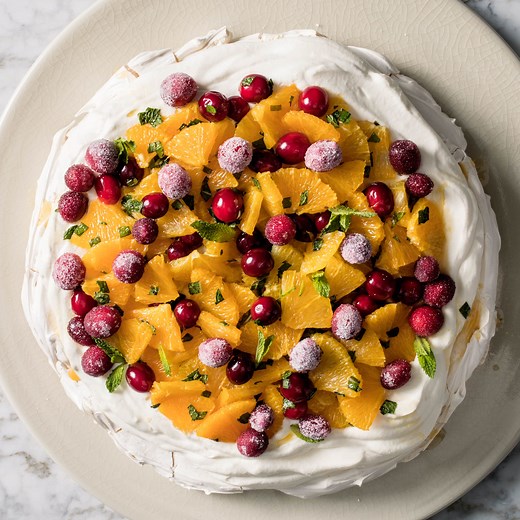 Orange, Cranberry, and Mint Pavlova with Whipped Cream | America's Test Kitchen