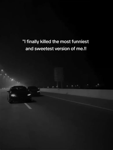 Sleek Black Car Speeding on Highway at Night