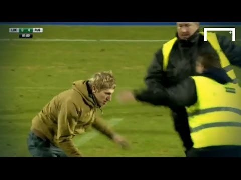 FUNNY! Pitch invader dribbles past two stewards