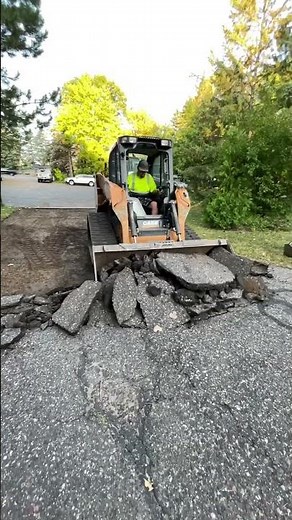 Removing asphalt paving.