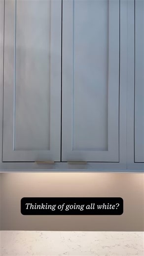 White cabinets are timeless, but pairing them with natural wood tones adds warmth, contrast, and depth. #whitecabinets | CliqStudios