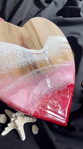 This heart-shaped resin artwork features soft pinks and vibrant red, layered with delicate white waves and intricate lacing. The original piece is available now, with commissions and Sydney studio workshops offered. #resinart #heartart #handmadeart | Graphiq Design