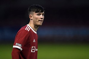 Tyrell Malacia congratulates Charlie McNeill on impressive u21 display