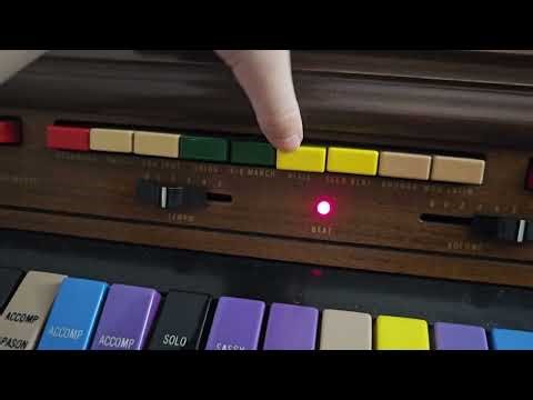 My son teaches me how to play the electric organ