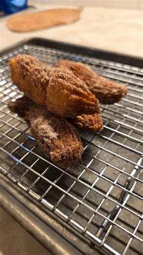 Steve Paniagua on Instagram: "Churros #mexicanfood #mexican #churro A churro is a crispy fried pastry that originated in Spain and is commonly found in Mexican cuisine. The dough is made from flour, water, and salt, and piped into ridges using a star-shaped nozzle. After frying until golden brown, churros are typically rolled in cinnamon sugar for flavor and sweetness. They can be eaten alone or with dipping sauces like chocolate or cajeta, a Mexican caramel."