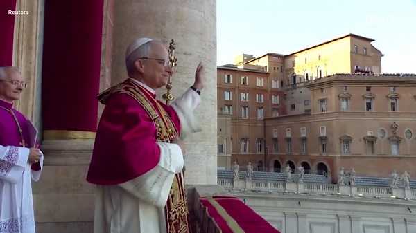 Pope Leo XIV greets the crowd in St. Peter's Square in papal robes